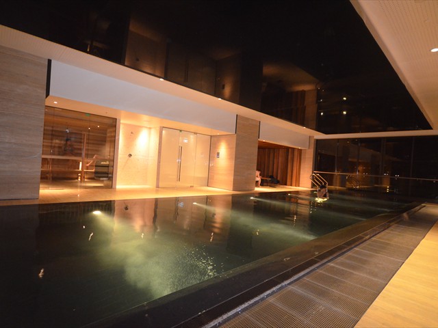 ABODE: Heated black granite infinity pool in level 9 spa centre, Sauna and Steam Room