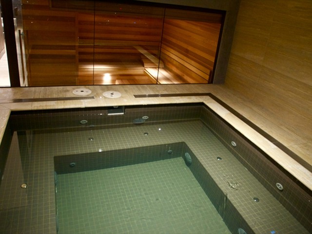 55th floor spa/jacuzzi with adjacent sauna with Melbourne city skyline views