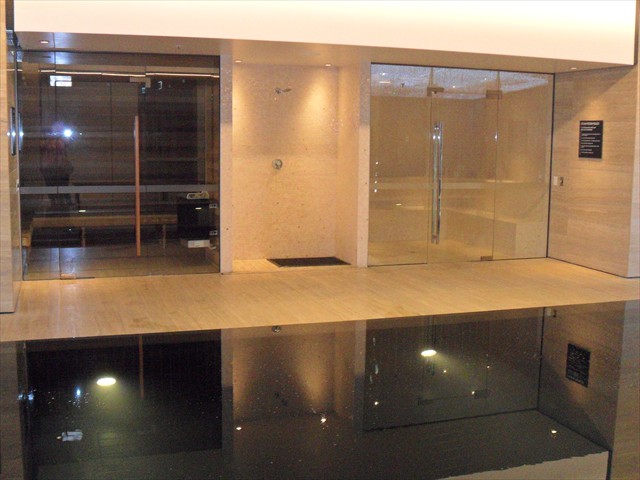 Heated black granite infinity pool in level 9 spa centre, Sauna and Steam Room